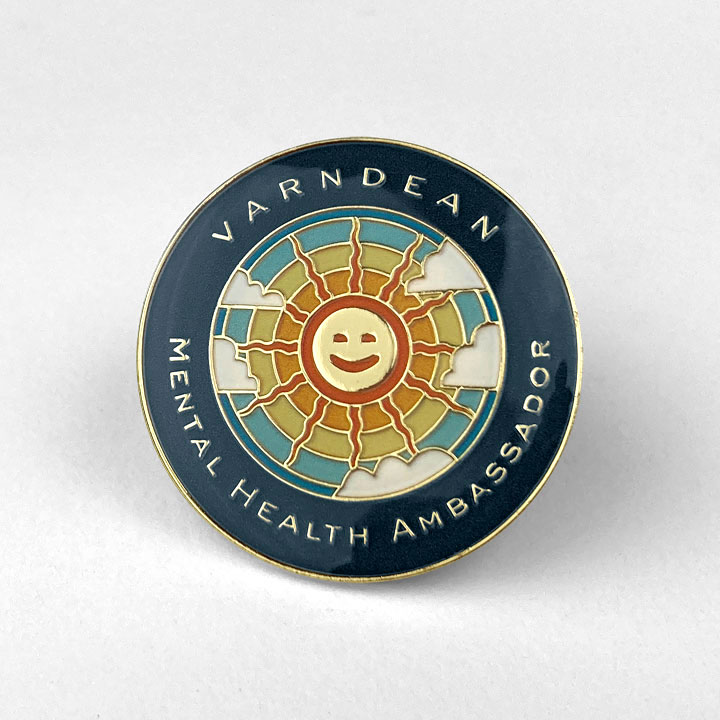 School Badges - Mental Health Ambassador showing a happy sun with parting clouds - Toop Studio