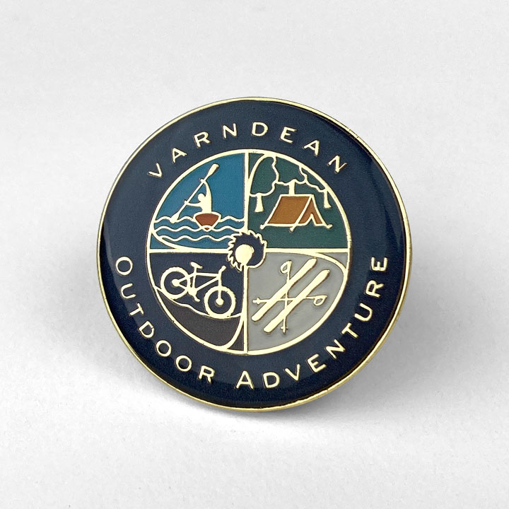 School Badges - Outdoor Adventure with 4 quadrants, the first showing a kayak, the second is a tent, the third is a mountain bike and the fourth is a set of skis - Toop Studio